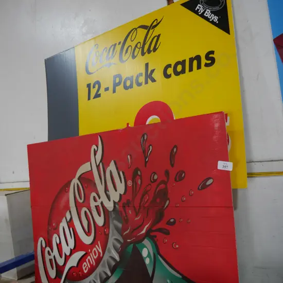 2 Coca cola signs