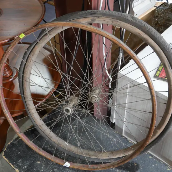 2 wooden bicycle wheels