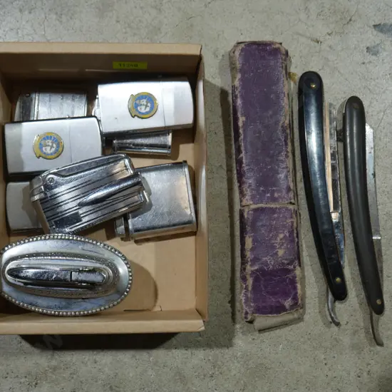 Vintage cigarette lighters and cutthroat razors