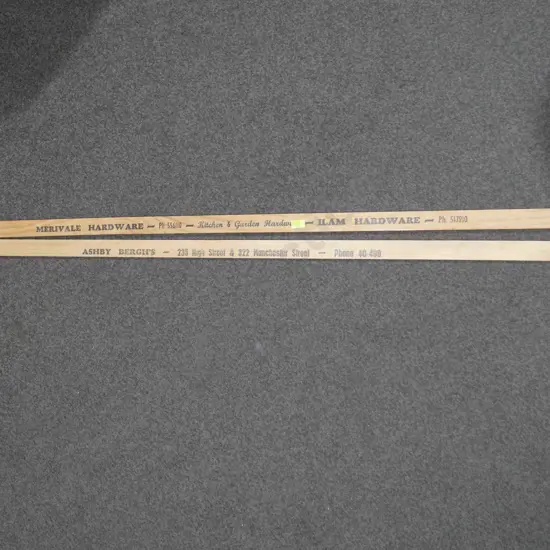 2 wooden advertising rulers