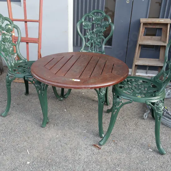 Quality wooden table and 3 cast chairs