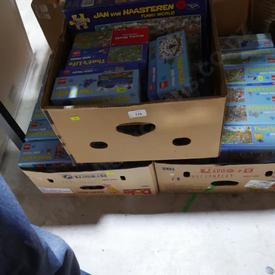 Three boxes of jigsaw puzzles