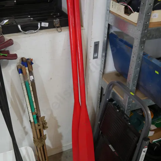 Red wooden oars