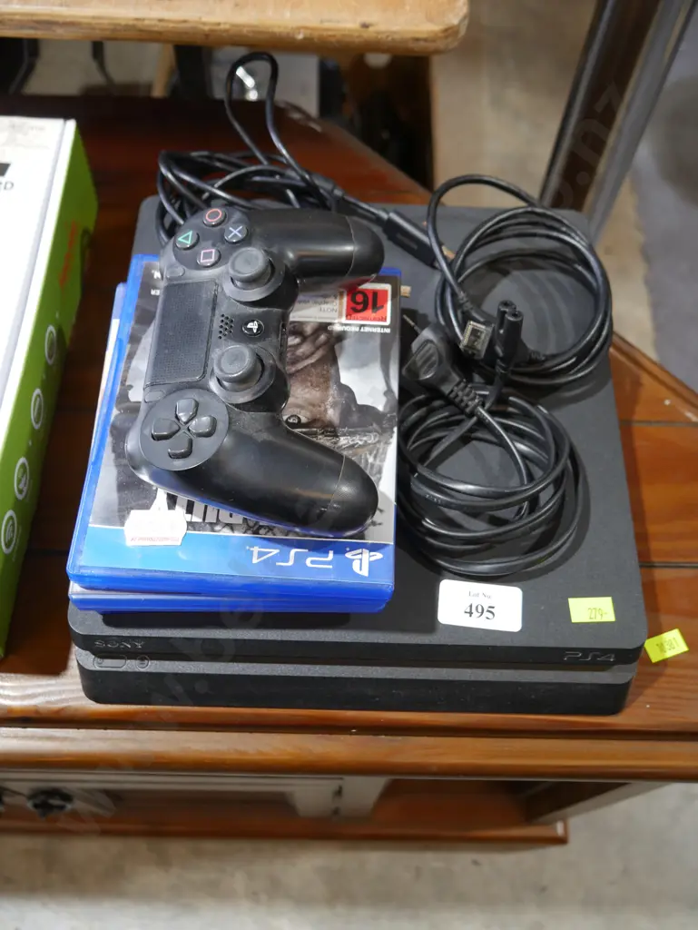 PS4 with games and controller Image 1++