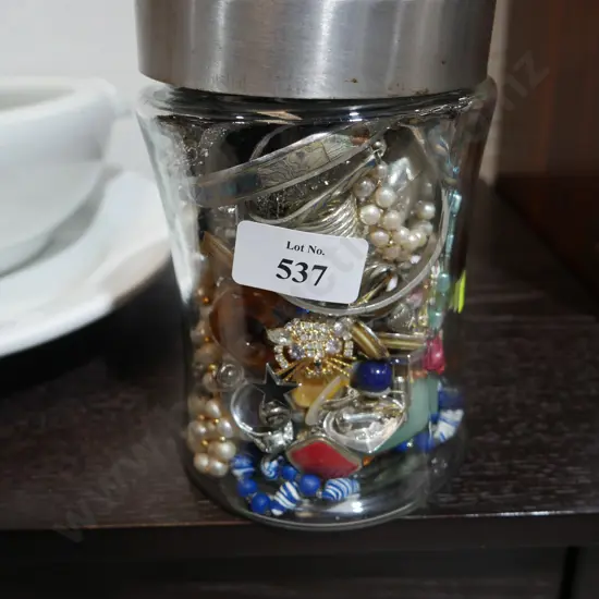 Glass jar of costume jewellery