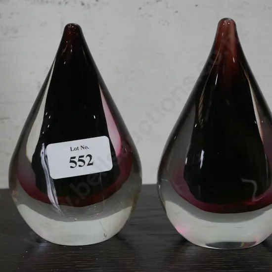 A pear of glass paperweights