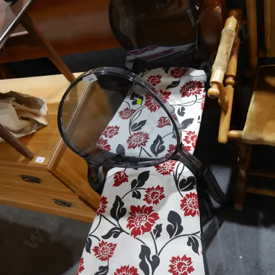 Two plastic dining chairs