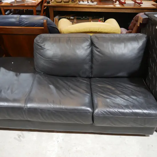Black leather corner lounge suite