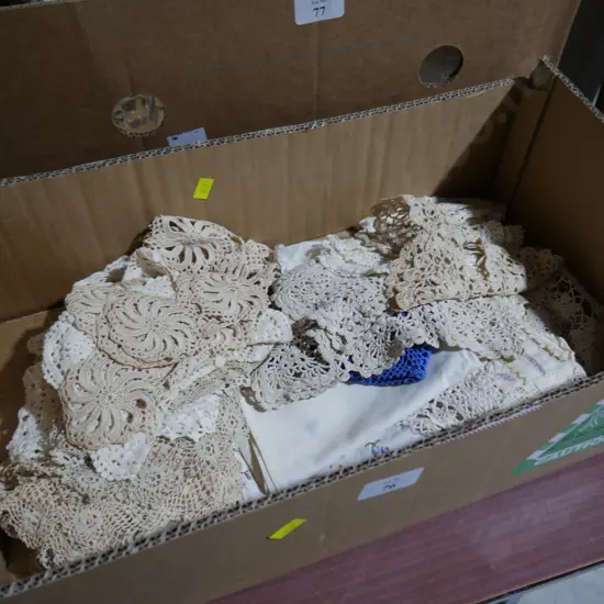 Box of lace doilies and lampshade