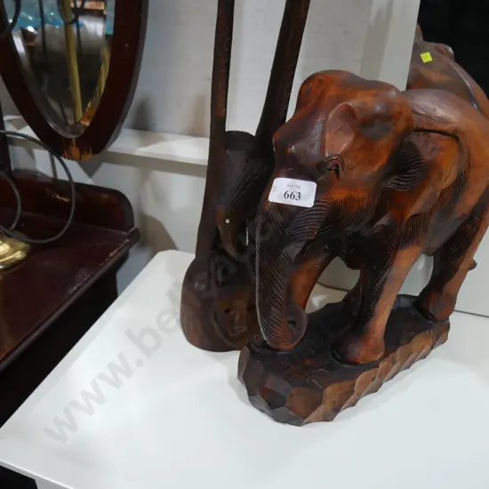 Wooden elephant and eagle ornaments