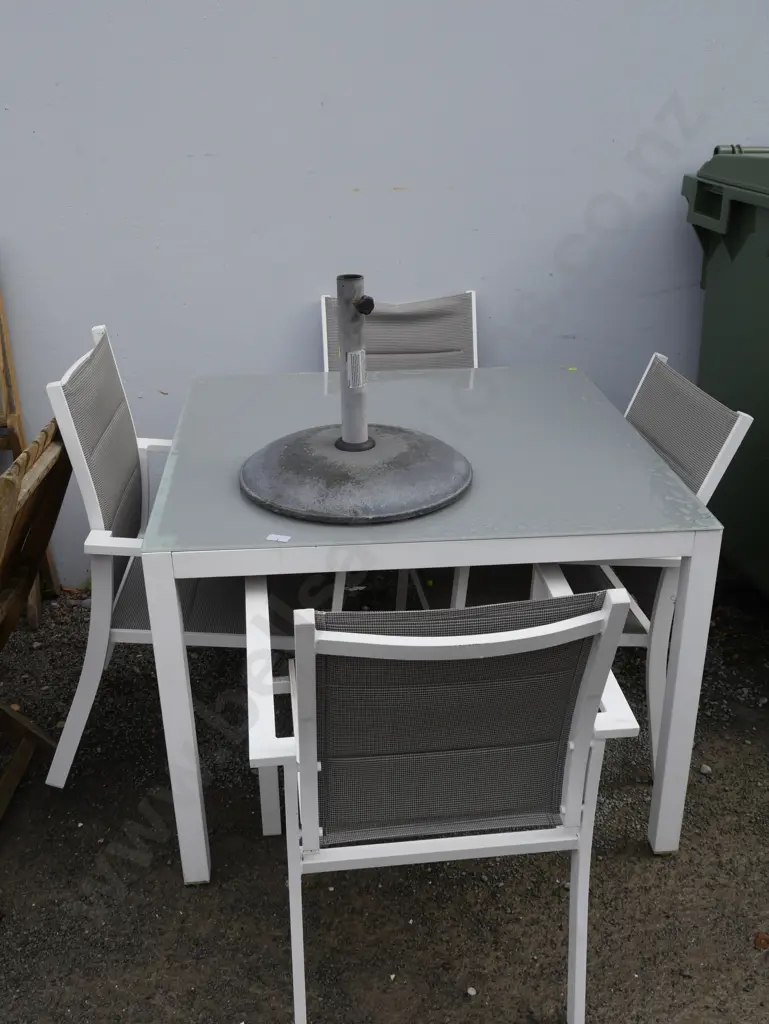 Glass top outdoor table, four chairs and umbrella stand Image 1++