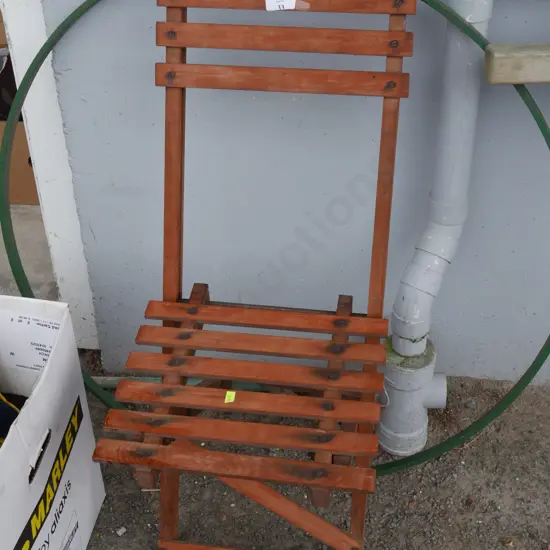 Green metal hoop and folding chair