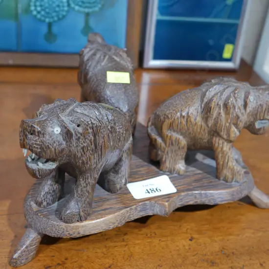 Carved wooden lions ornament