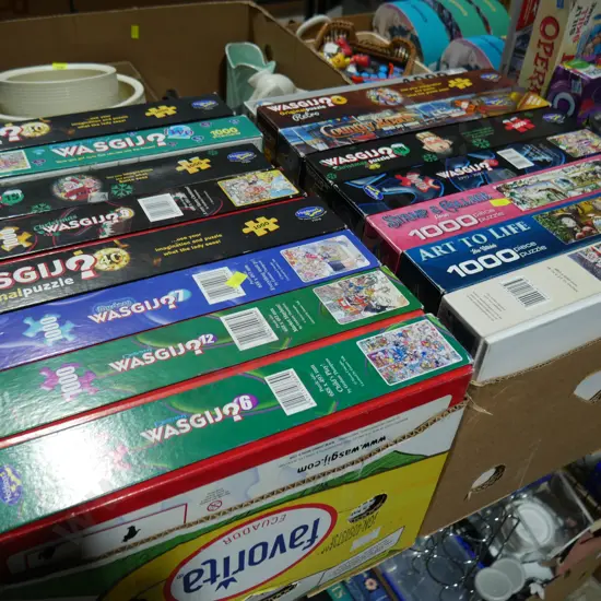 2 boxes of jigsaw puzzles