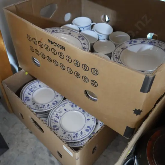 2 boxes of dinnerware