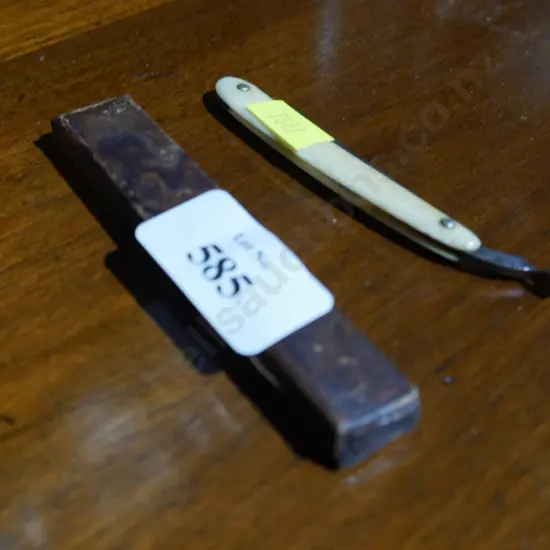 Miniature cut throat razor in case