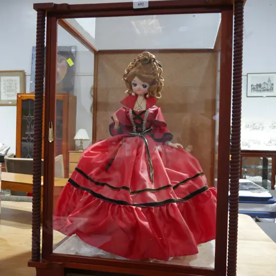 Doll in display case