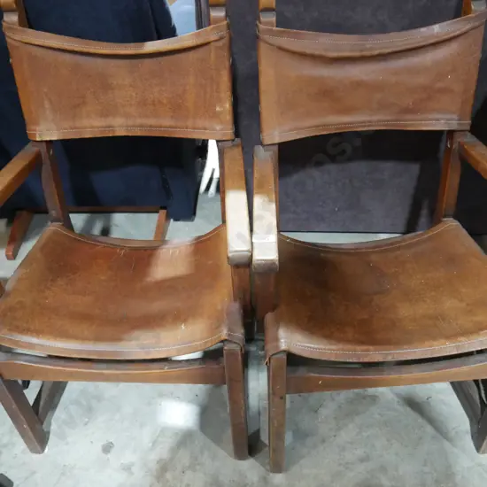2 leather back elbow chairs