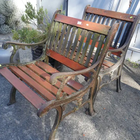 2 Cast iron framed chairs