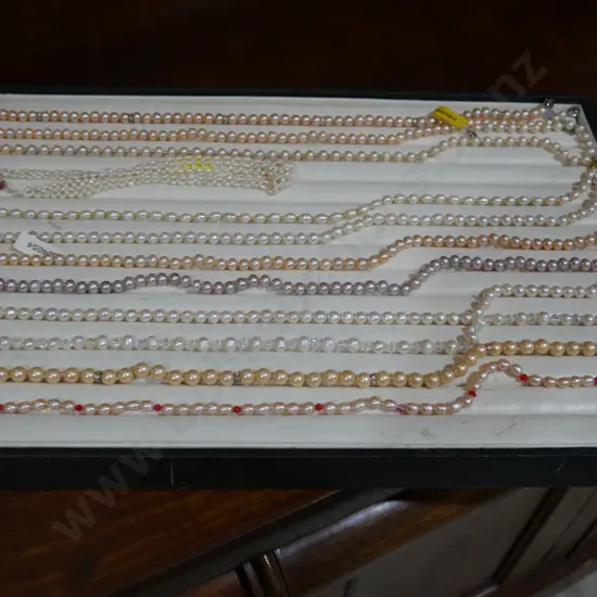 Jewellery necklaces on display board