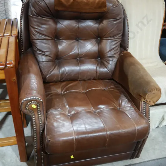 Deep buttoned leather arm chair