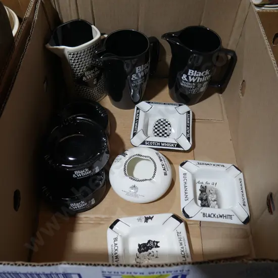 Black and white whiskey jugs and ashtrays